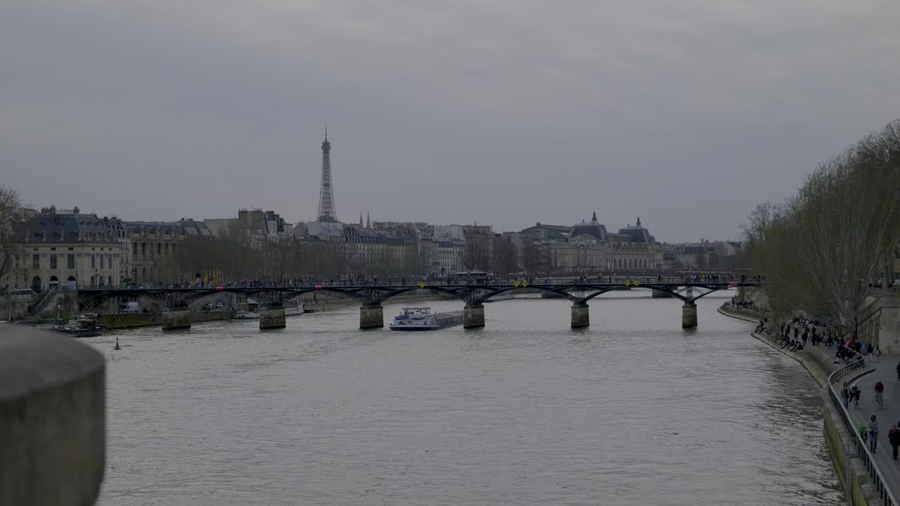 Scenic view of Paris along the Seine River, with the Eiffel Tower visible in the background