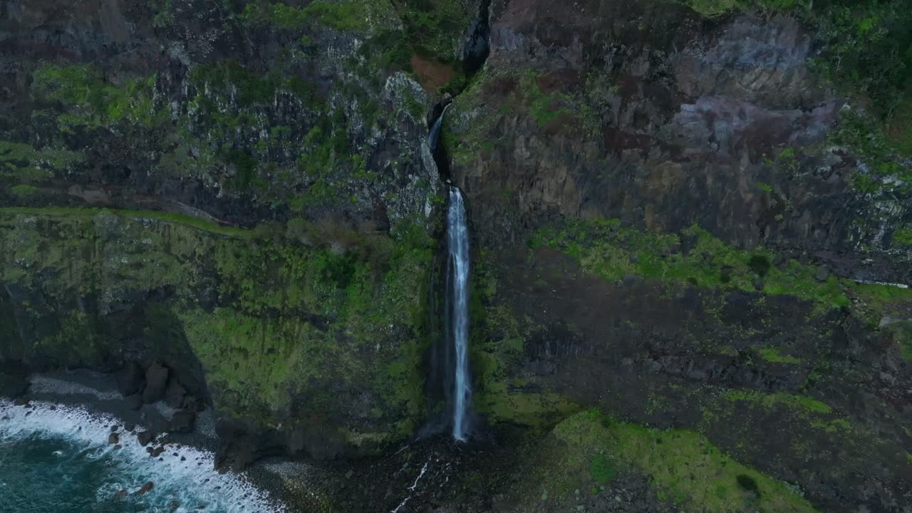 Aerial view of the V&eacute;u da Noiva waterfall and greenery in Madeira