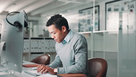 Man working on a computer in a modern office