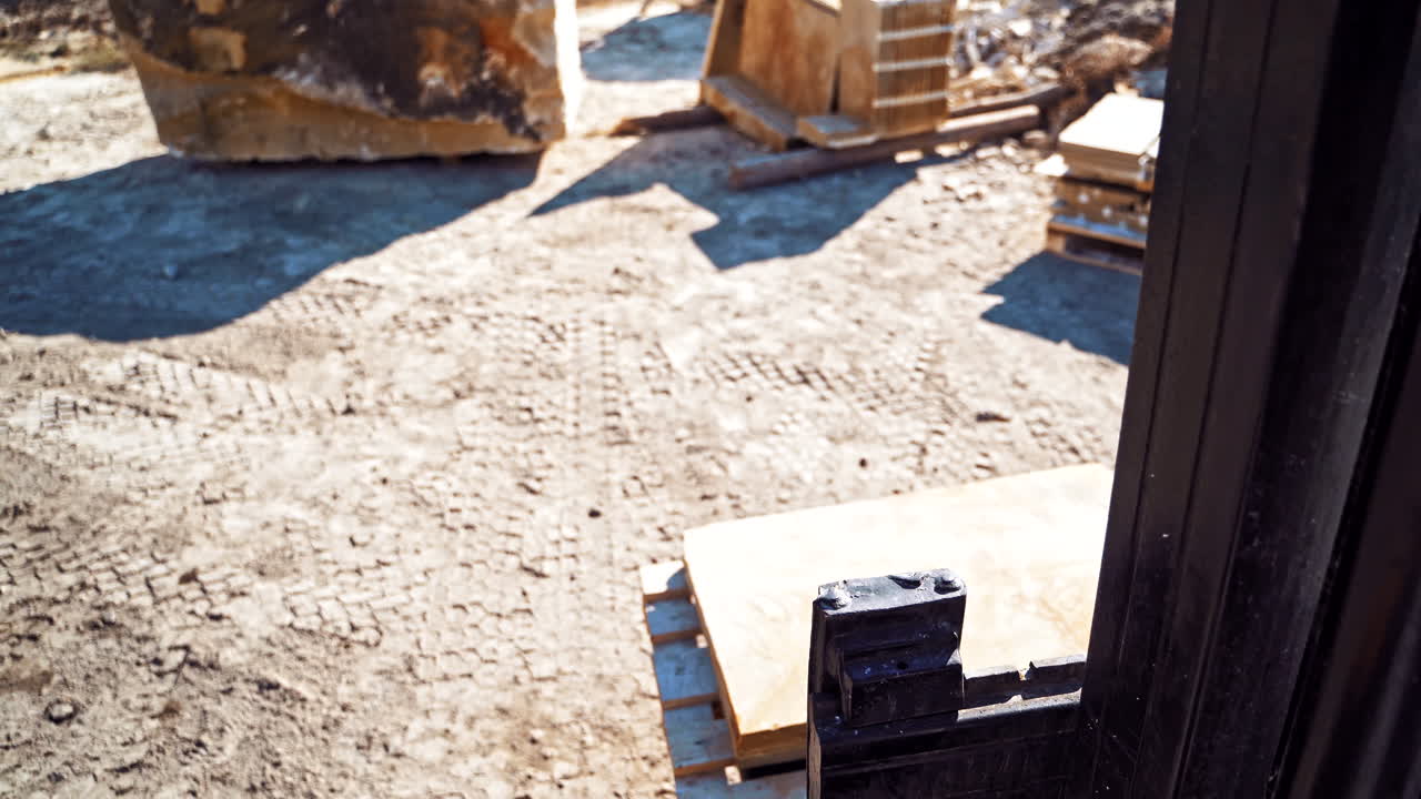 Forklift loading marble. Forklift loader for quarry works outdoors