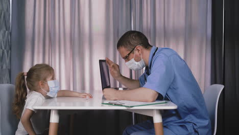 doctor-checks-temperature-and-girl-throws-mask-in-hospital
