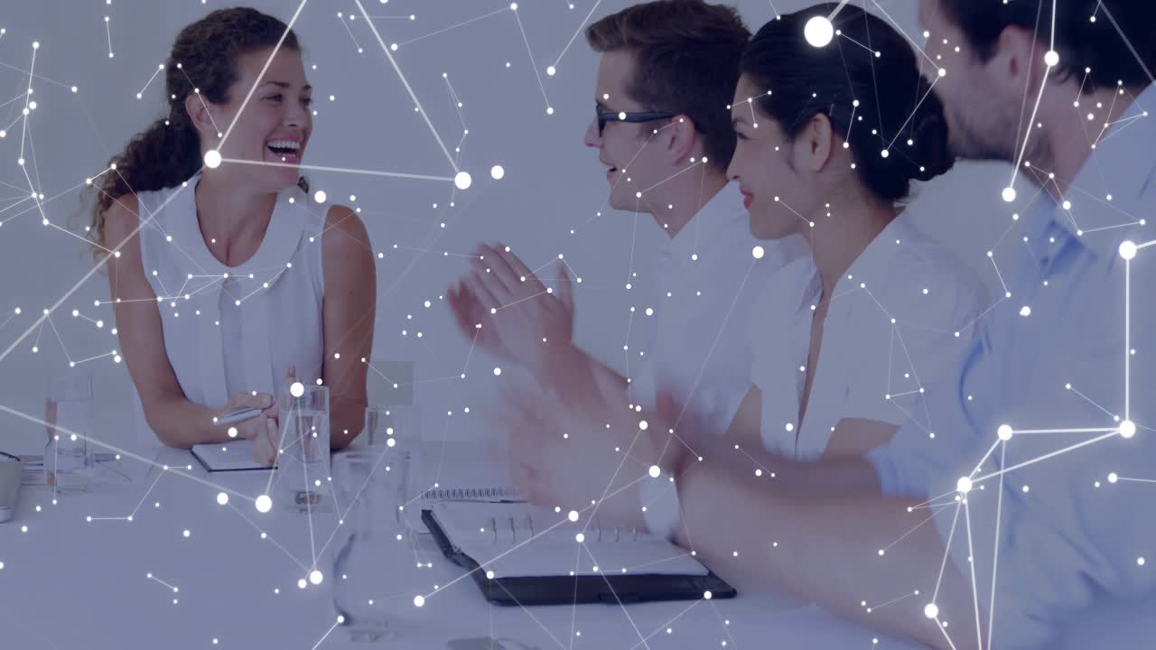 Left woman smiling sparking team clapping in praise in biz meeting node overlay partly hiding faces