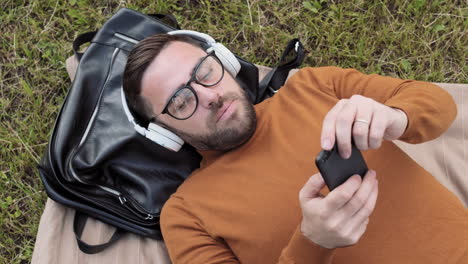 man lying on ground relaxing