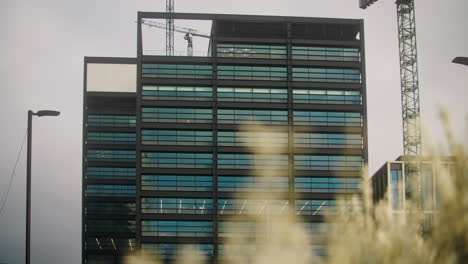 camera pans across a newly constructed building in the paradise development in birmingham uk