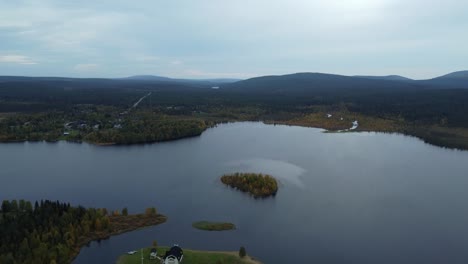 Aerial-drone-shot-of-lake-with-island-in-Iceland