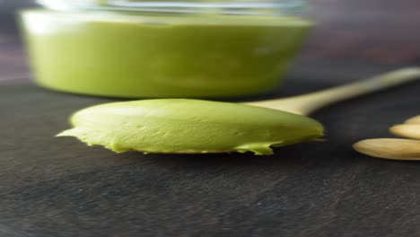 pistachio butter on wooden spoon