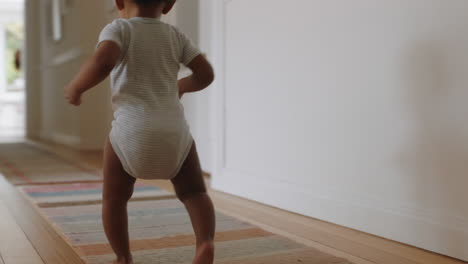 happy baby girl learning to walk toddler exploring home curious infant walking through house enjoying childhood