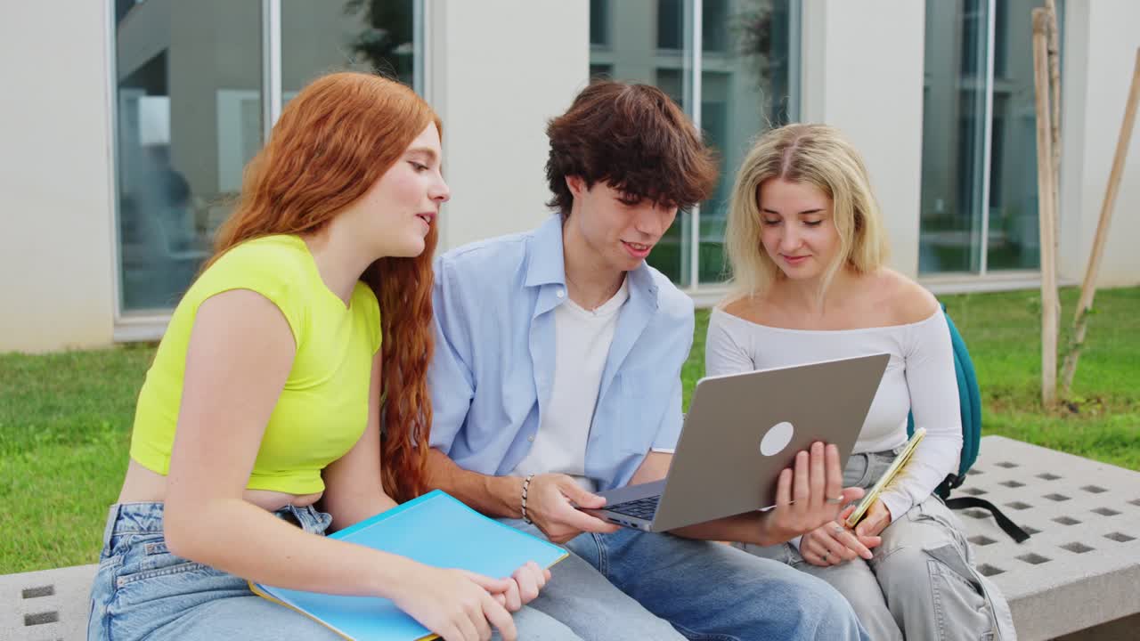 Students working on a laptop together