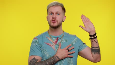 sincere responsible tourist man raising hand to take oath, promising to be honest and to tell truth