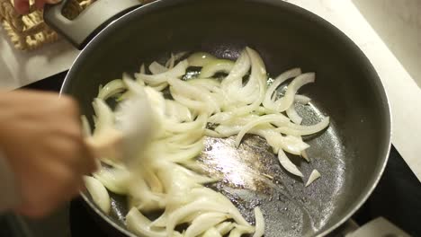 cooking sauteed onions in a pan