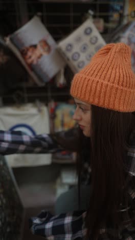 woman browsing souvenirs in a market