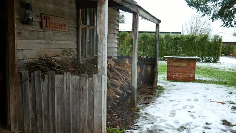 Water-drips-from-the-metal-roof-of-an-old-miner's-cottage-after-snow