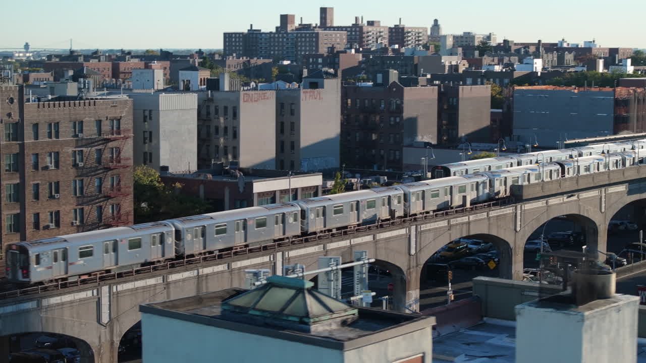 Establishing shot of a New York City subway train in Queens. Shot on an Autumn morning in 4k.