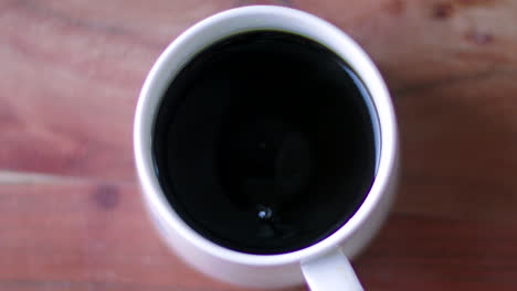 a mug catches the last drop of coffee