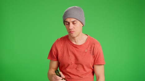 unemployed man drinking alcohol on green screen background
