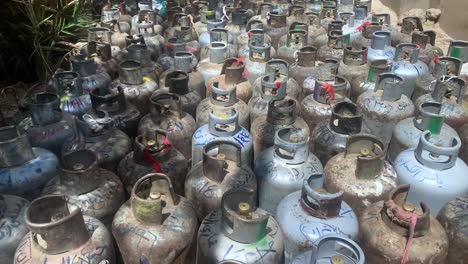 pan down to liquid petroleum gas cylinder during a big shortage and rise of the prices