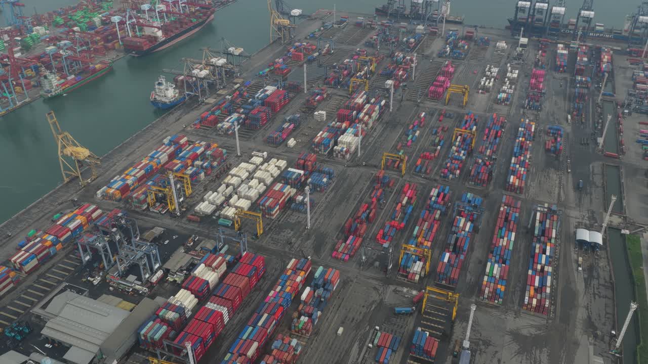 Aerial perspective of industrial port infrastructure and shipping lanes in Jakarta, highlighting maritime trade routes and large-scale logistics facilities