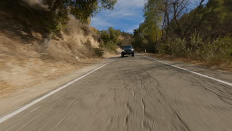 low angle fpv cinematic shot of rezvani's super tank pleasing jungle safari on holidays to national park off road trip