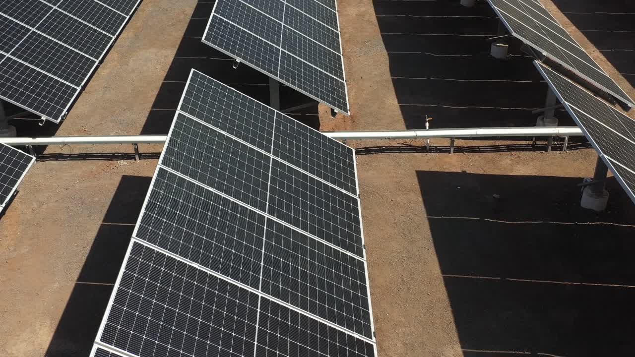 aerial drone view of modern photovoltic solar battery. Rows of sustainable energy solar penal4k video