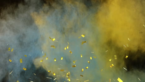 animation of gold confetti falling, with yellow and blue coloured powder on black background