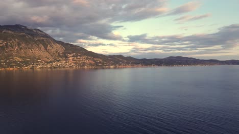 aerial view of messinian gulf, left pan revealing cityscape of kalamata, on a cloudy spring afternoon 4k