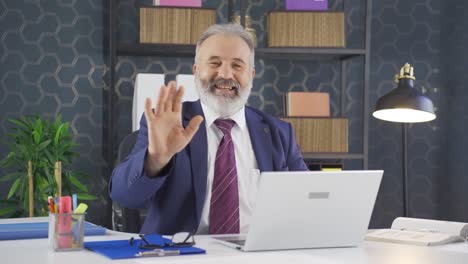 cheerful and happy happy businessman waving at camera.