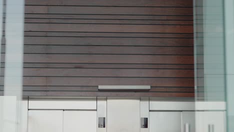 modern elevator deck with wood and glass