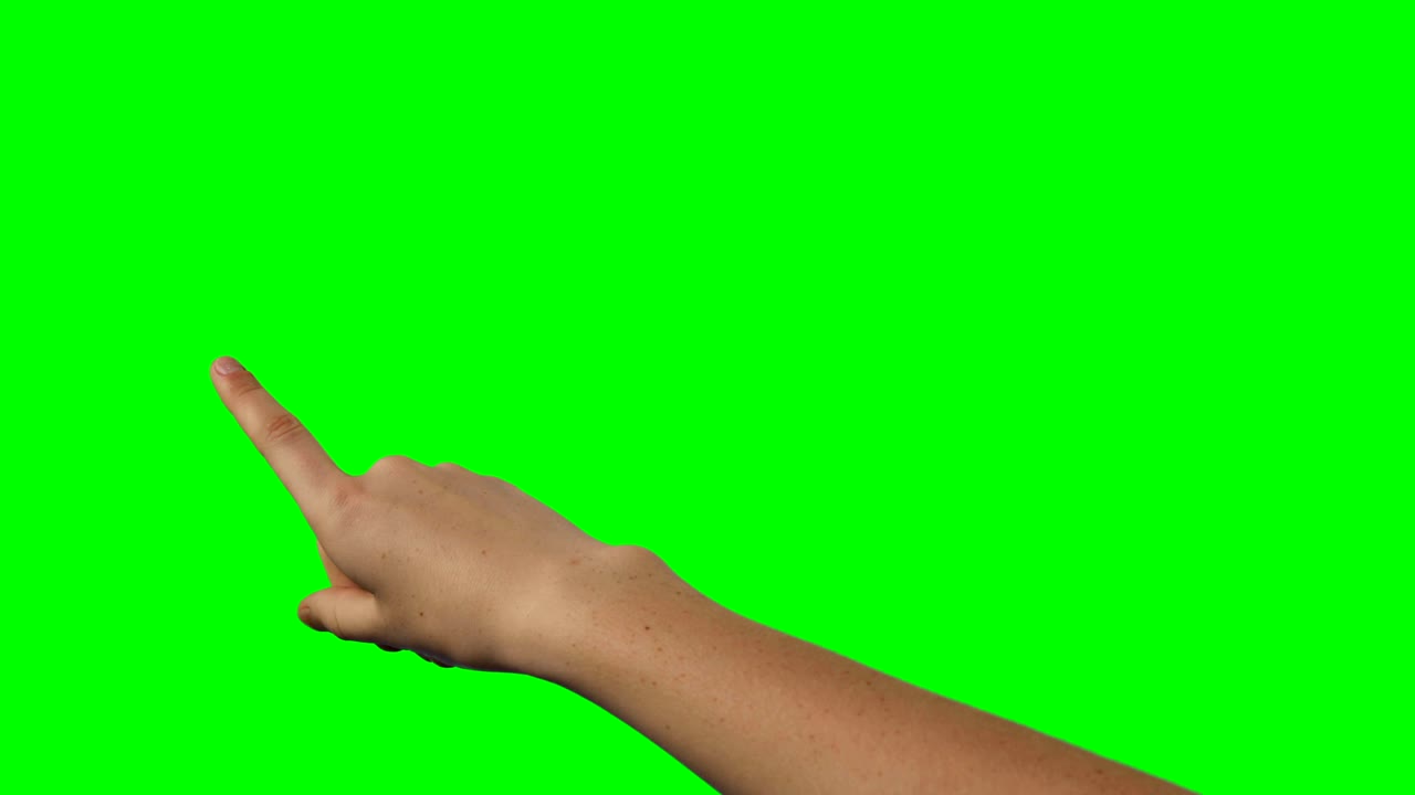 Person making hand gesture against green screen background