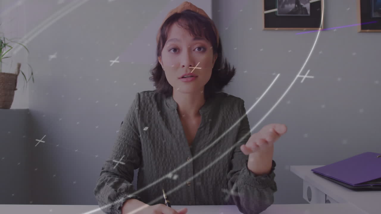 Woman explaining concept with swirling lines and symbols animation overlay