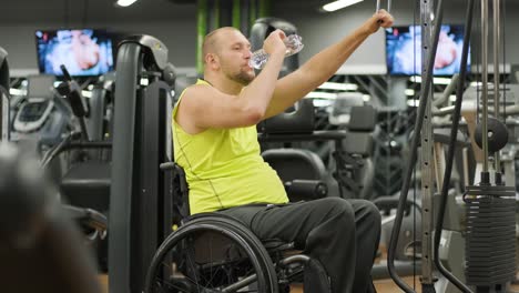 man with disabilities training in the gym of rehabilitation center