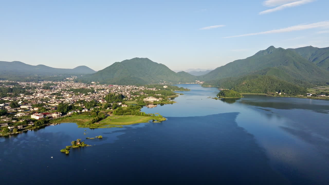 Drone flying over lake Kawaguchi, summer morning in Fujikawaguchiko, Japan