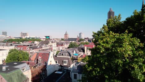 Drone-Shot-of-Utrecht,-Netherlands,-Historic-City-Center,-Homes-and-Dom-Tower-in-Reconstruction
