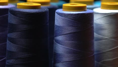 closeup of blue cotton thread in a organic textiles clothing and cloth sweatshop in pakistan