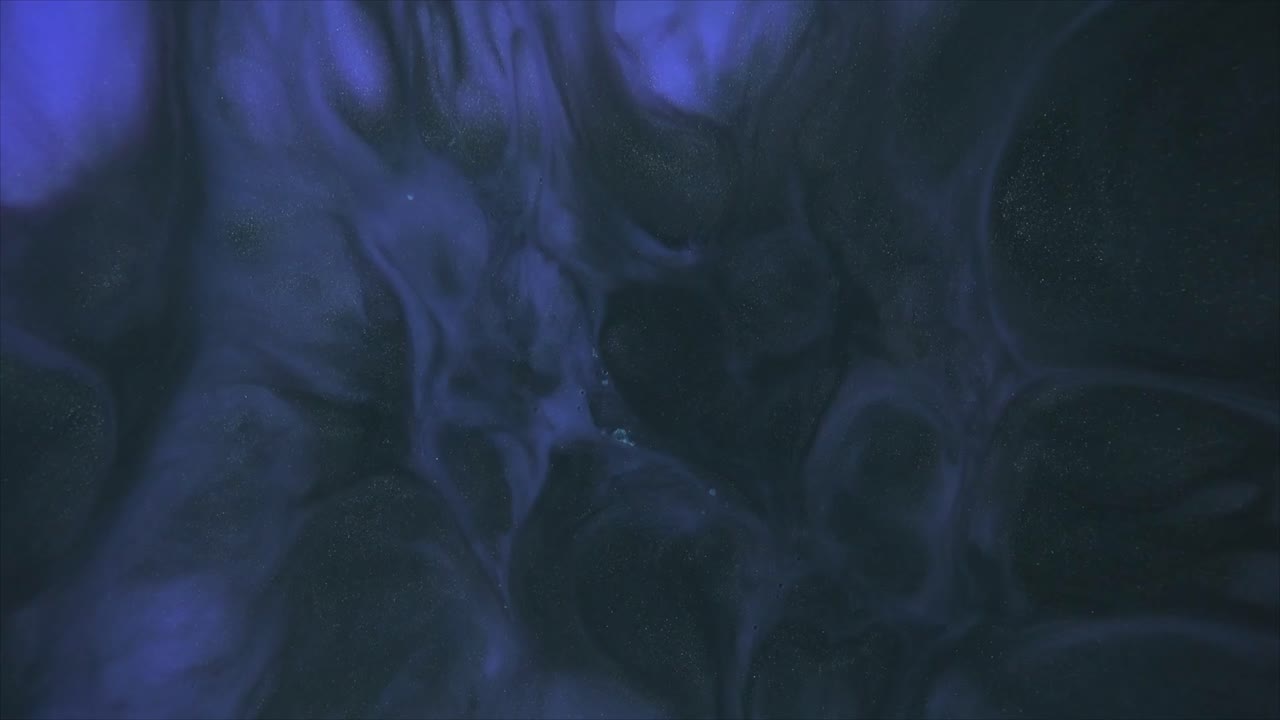 Abstract Dark Blue and Purple Liquid Swirling with Shimmering Particles