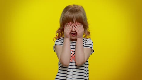 little teen child kid girl closing eyes with hand showing stop gesture, confused shy scared to watch
