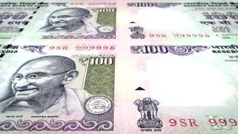 banknotes of one hundred indian rupees of india rolling, cash money, loop