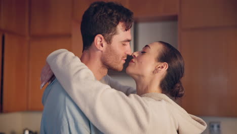 Couple,-kiss-and-hug-in-home