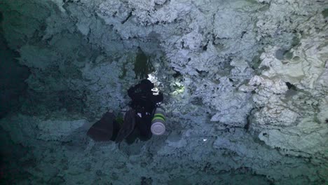 Technical-Diver-with-side-mount-tanks-diving-in-Cave-Cenote-Chikin-Ha-in-Yucatan-Mexico