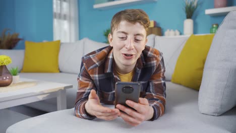 Young-man-video-chatting-with-his-friend.
