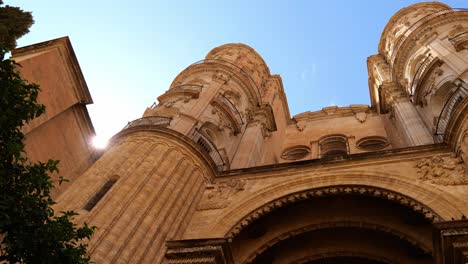 historic building of malaga in spain against blue sky - low angle