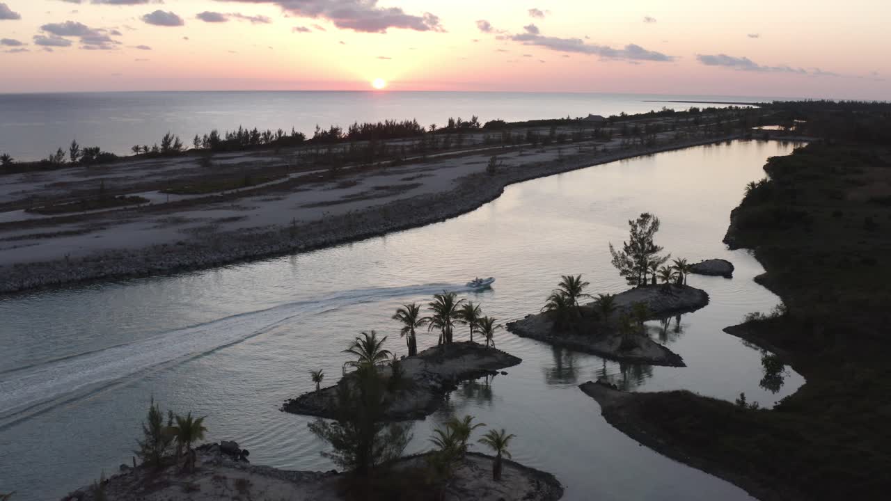 Aerial View, Speedboat Sailing in Lagoon on Grand Bahama Coastline at Twilight. Drone Shot