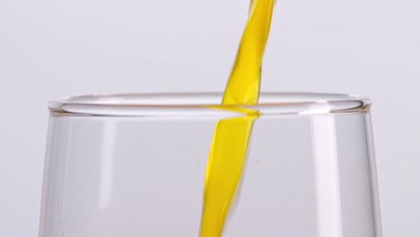 orange juice pouring into a glass