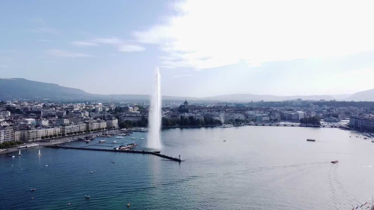 Geneva Cityscape with Lake Jet d'Eau Water Fountain - Aerial Pullback