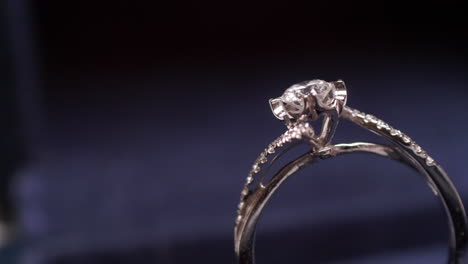 close-up of a diamond engagement ring panning from the right to the left side of the frame