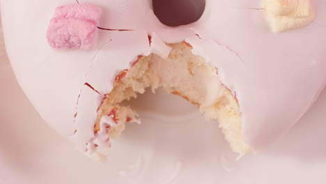pink glazed donut with marshmallows