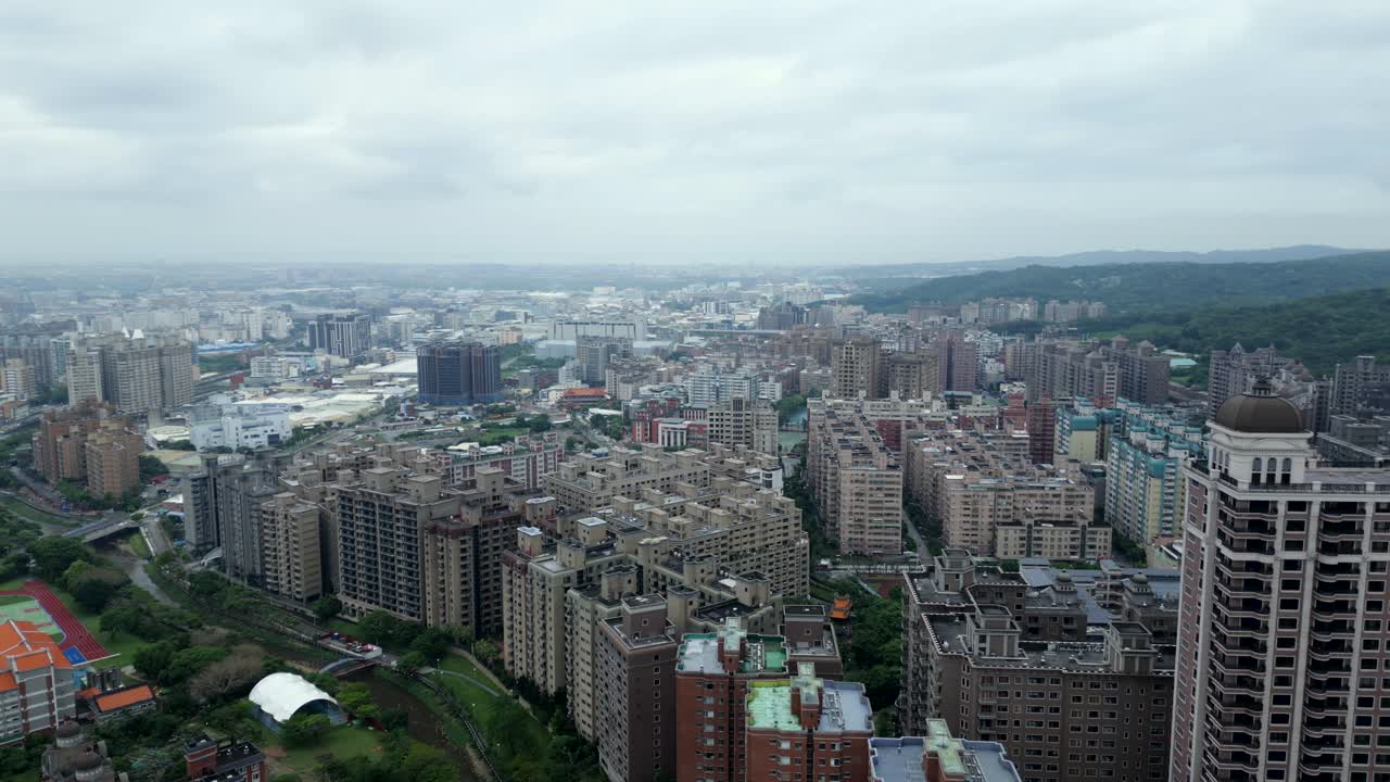 Luzhu District, Taoyuan City, aerial view of urban area with dense buildings and green spaces