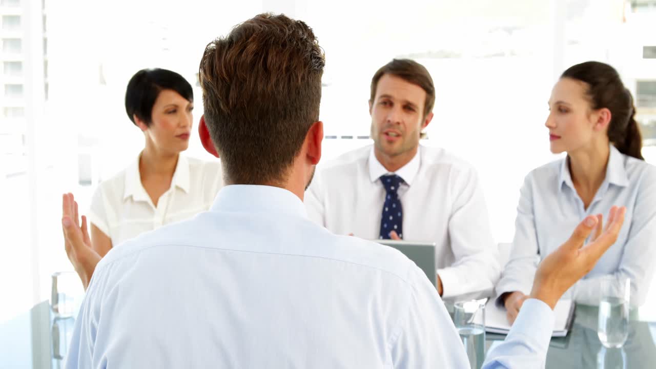 Premium stock video - Interview panel listening to applicant