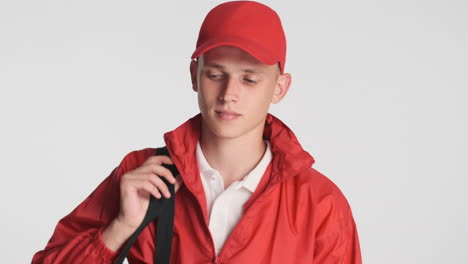 Delivery-guy-in-red-uniform-and-backpack