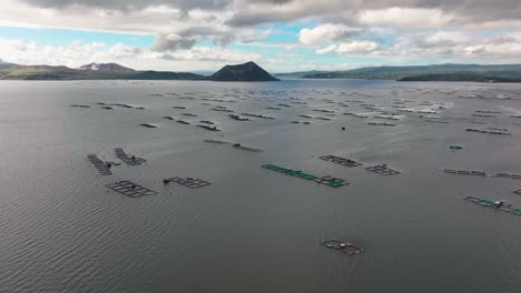 many fishing cages on taal lake in philippines during cloudy day