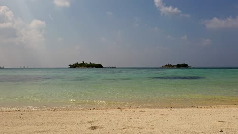 Low-angle-moving-toward-seashore-from-sandy-beach-in-Maldives